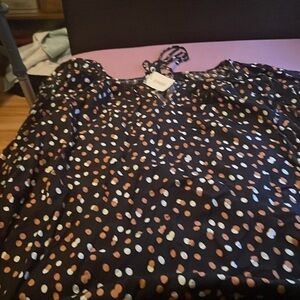 Woman’s high low dress color, black with white and tan Polkadots by Evans 30/32